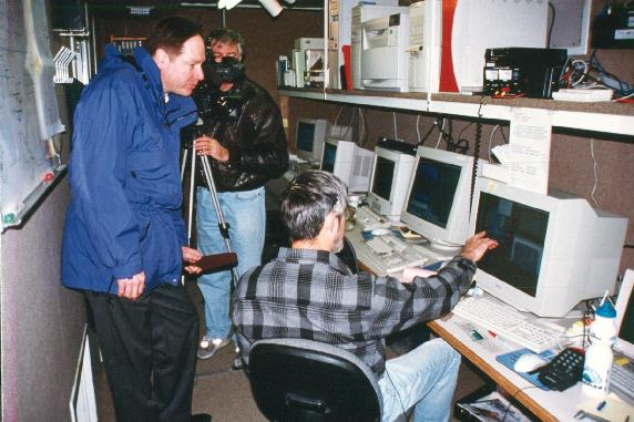 John Locatelli (UW) and TV news team at S-Pol science trailer..jpg